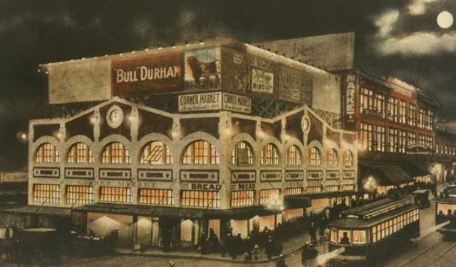 The Corner Market building opens, with Three Girls Bakery as one of the shops.