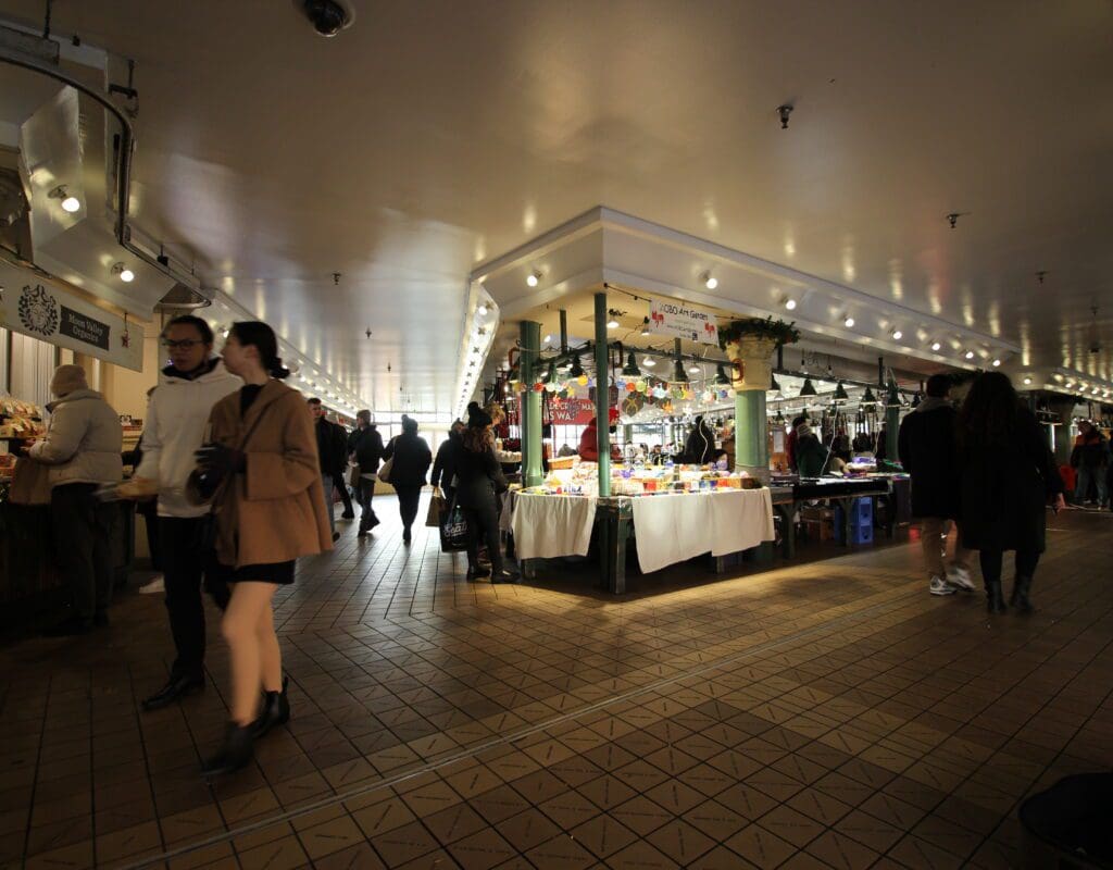 people shopping in the handmade craft market at Pike Place Market in seattle