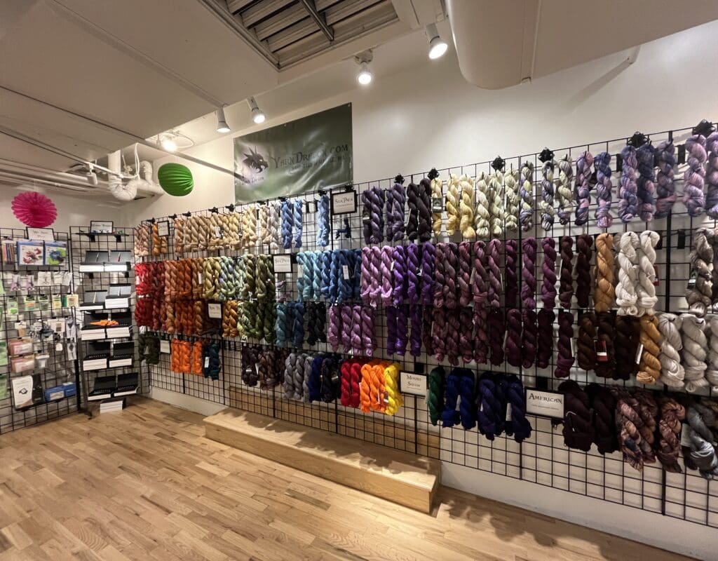 Colorful hand dyed yarn hang inside Yarn Dragon a new shop in Pike Place Market
